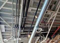 the air handling unit is on the ceiling of the building and is visibly left uncovered. Royalty Free Stock Photo