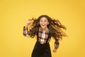 Air in her hair. natural beauty. Girl kid long hair flying in air. Child with natural beautiful healthy hair yellow