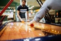 Air hockey is fun even for adults Royalty Free Stock Photo