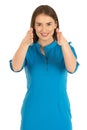 Air hostess in blue uniform. Showing the way to emergency exit. Royalty Free Stock Photo