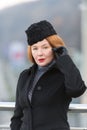 Air-hostess welcome you. Red hair lady in hat. Portrait of lady in coat.Lady love hat.Spring fashion for female. Styled women