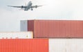 Air logistics. Cargo airplane flying above stack of logistic container. Cargo and shipping business. Container ship for export Royalty Free Stock Photo