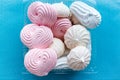 The meringue in the container on blue background Royalty Free Stock Photo
