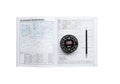 Air navigation training manual with compass and pencil on top of an open book Royalty Free Stock Photo