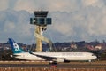 Air New Zealand Boeing 767 large commercial airliner taxis past the air traffic control tower at Sydney Airport Royalty Free Stock Photo