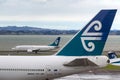 Air New Zealand Boeing 747-419 ZK-NBT on the tarmac at Auckland International Airport with an Air New Zealand Boeing 737 behind. Royalty Free Stock Photo