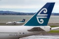 Air New Zealand Boeing 747-419 ZK-NBT on the tarmac at Auckland International Airport with an Air New Zealand Dash 8 behind. Royalty Free Stock Photo