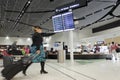 Air New Zealand flight attendant passing through the new Auckland airport International departure area