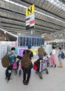 air passengers watch timetable of departures in Bangkok international airport