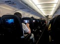 Air passengers watching media in aeroplane