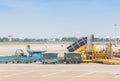 Air plane in airport terminal loading passengers and cargo luggage. Boarding aircraft process Royalty Free Stock Photo