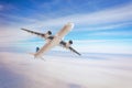 Air plane flies in the sky clouds fly high Royalty Free Stock Photo