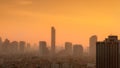 Air pollution in Bangkok, Thailand. Smog and fine dust of pm2.5 covered city in the morning with orange sunrise sky. Cityscape