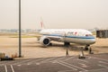 Air pollution in Beijing international airport with commercial passenger jet. Royalty Free Stock Photo