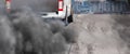 Air pollution from diesel vehicle exhaust pipe on road