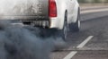 Air pollution crisis in city from diesel vehicle exhaust pipe