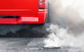 Air pollution crisis in city from diesel vehicle exhaust pipe on road