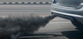 Air pollution crisis in city from diesel vehicle exhaust pipe on road