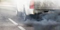 Air pollution from diesel vehicle exhaust pipe on road