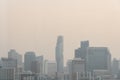 Air pollution effect made low visibility cityscape with haze and fog from dust in the air during sunset in Bangkok, Thailand