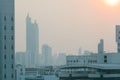 Air pollution effect made low visibility cityscape with haze and fog from dust in the air during sunset in Bangkok, Thailand