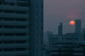 Air pollution effect made low visibility cityscape with haze and fog from dust in the air during sunset in Bangkok, Thailand