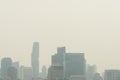 Air pollution effect made low visibility cityscape with haze and fog from dust in the air during sunset in Bangkok, Thailand