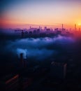 Air pollution in industrial era, large factory smoke stacks in sunset, generative ai