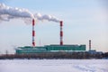 Air pollution from a natural gas and coal power plant. Emissions of harmful substances into the atmosphere. Traditional Royalty Free Stock Photo