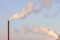 Air pollution from a pipe of an old stoker on a blue sky background Royalty Free Stock Photo