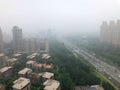 Top view highway with severe air pollution, fog and haze in Beijing city, China.