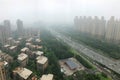 Top view highway with severe air pollution, fog and haze in Beijing city, China.