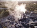 Air pollution by smoke coming out factory chimneys. Aerial Royalty Free Stock Photo