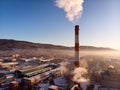 Air pollution by smoke coming out of two factory chimneys. Industrial zone in the city. aerial view Royalty Free Stock Photo
