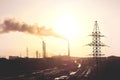 Air pollution smoke from pipes and factory with sunset background Royalty Free Stock Photo