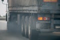 Air pollution from truck vehicle exhaust pipe on road