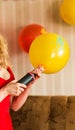 Air pump and balloon indoors Royalty Free Stock Photo