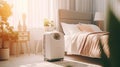 Air purifier in cozy white bedroom for filter and cleaning removing dust PM2.5 HEPA and virus in home,for fresh air and healthy Royalty Free Stock Photo