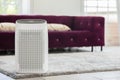 Air purifier in cozy white Living room for filter and cleaning removing dust PM2.5 HEPA in home