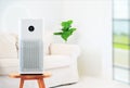 Air purifier a living room, air cleaner removing fine dust in house. protect PM 2.5 dust and air pollution concept