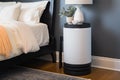 air purifier on nightstand, providing peaceful and healthy sleeping environment