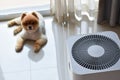 Air purifier system cleaning dust pm 2.5 pollution in living room with cute dog