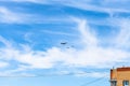 Air refueling of battleplane aircraft over house Royalty Free Stock Photo