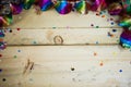 Air snakes and confetti on wooden background