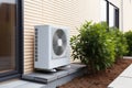 Air source heat pump installed at residential building outdoors Royalty Free Stock Photo
