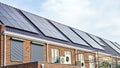 air source heat pump unit installed outdoors at a modern home with solar panels in the Netherlands Royalty Free Stock Photo