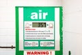 Air station service for vehicle tires. Automatic inflator with pressure level indicator on 35 psi at gas station. Self service air Royalty Free Stock Photo