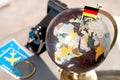 Air ticket and German flag on globe Royalty Free Stock Photo