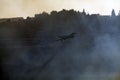 Air Tractor AT-802 Fire fighting aircraft extinguishing a fire Royalty Free Stock Photo