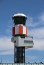 Air traffic control tower of Rotterdam The Hague Airport with blue sk